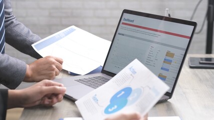   Close up of businessman hands discussing about business plan, Business team analyze business data at office