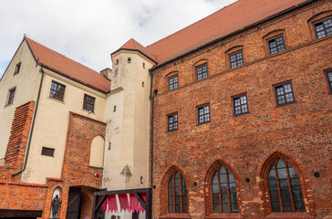view of the walls of the gothic castle in Darłowo. red brick and red tile make up the architecture...