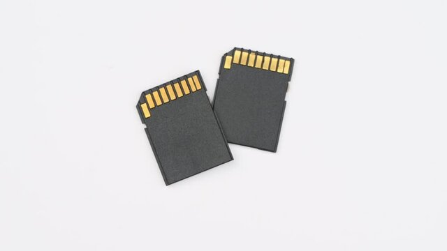 clips video 4k and full HD of memory SD card isolated on clean background this sd card for various computer, digital camera and smart mobile phone devices.