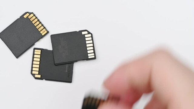 clips video 4k and full HD of memory SD card isolated on clean background this sd card for various computer, digital camera and smart mobile phone devices.