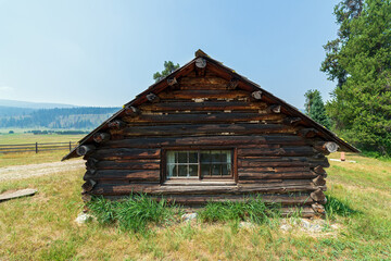 Rear window of an old log cabin in Idaho, USA