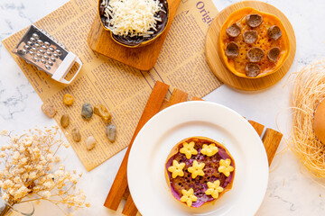 Kue Hok Lo Pan or Martabak Mini Bangka with various Topping. The martabak mini bangka is made from a mixture of flour, eggs, sugar, baking soda, coconut milk and water.