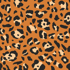 Leopard pattern. Trendy seamless vector texture. Animal print. Black spots on orange background. Cheetah skin imitation for painted on clothes or fabric.