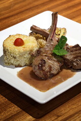 Rack of lamb with mint sauce and grilled risotto