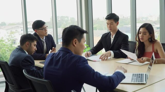 Group of asian business People Meeting Conference in office . marketing team Brainstorming Teamwork together at workspace.Discussion Corporate coworkers discussing Financial. meeting preparation