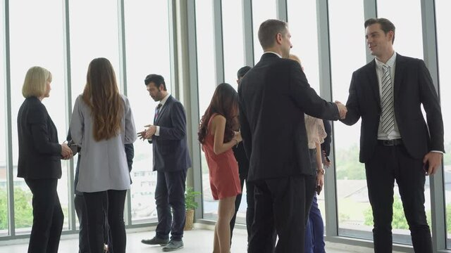 group of diverse business people handshake and talking together in  break after meeting . communication connection
