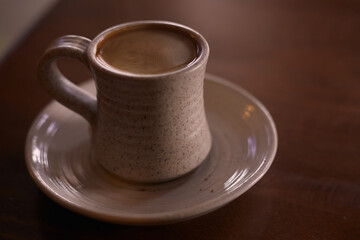 cup of coffee on wooden table