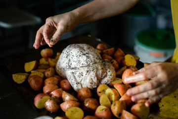 Cooking chicken baked with potatoes