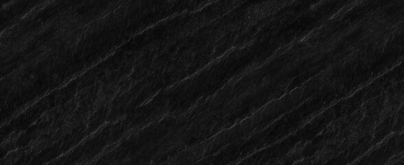 Panorama dark gray stone background with copy space. Black grunge banner with rock texture.