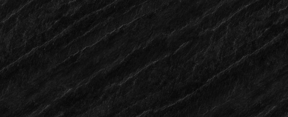 Panorama dark gray stone background with copy space. Black grunge banner with rock texture.