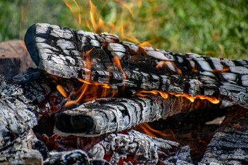 Campfire made of logs. Travel concept.