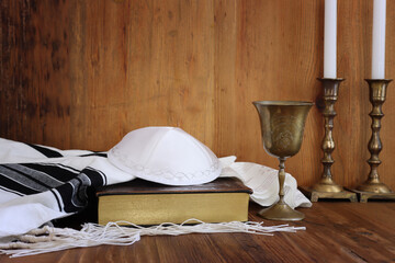 religion image of white talit and prayer book. Rosh hashanah (jewish New Year holiday), Shabbat and Yom kippur concept