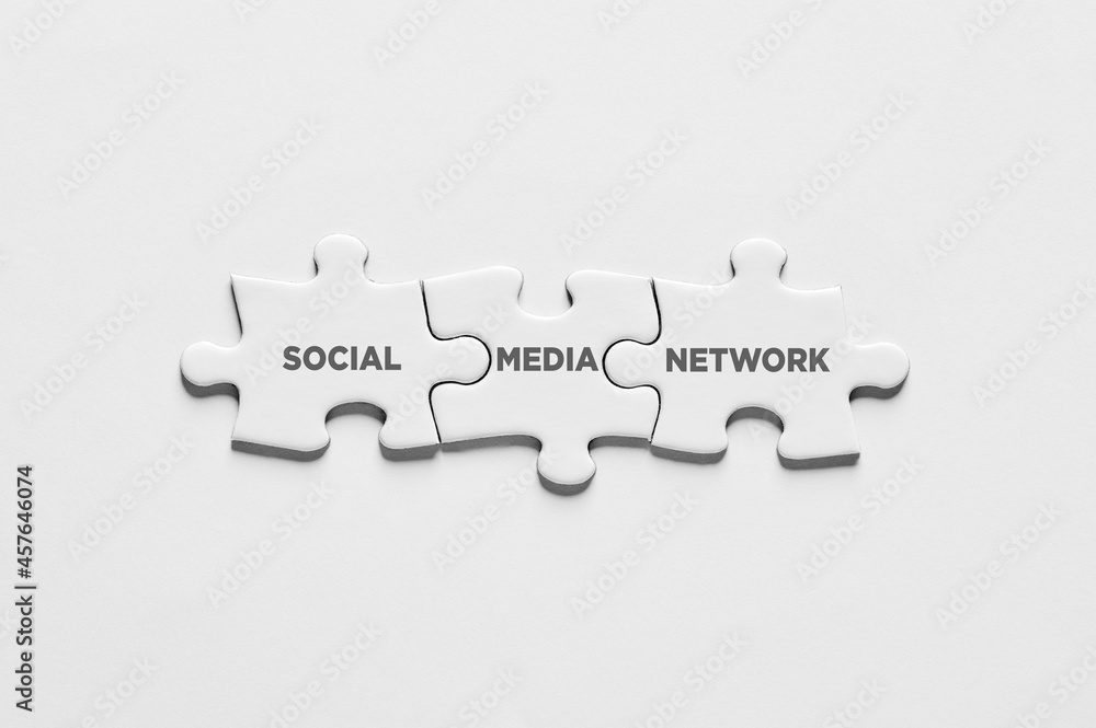 Poster the word social media network on puzzle pieces. connection communication or networking on social med
