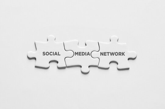 The word social media network on puzzle pieces. Connection communication or networking on social media