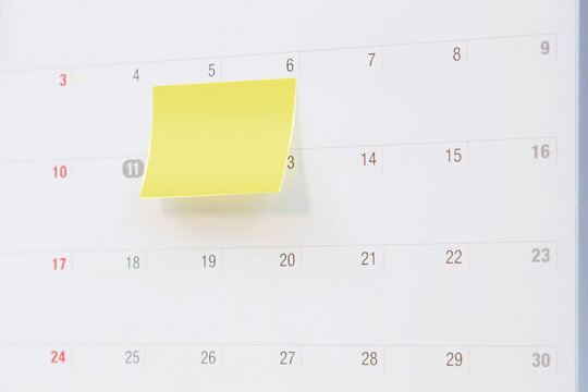 Calendar, blank desk calendar with paper note and office equipment concept of event planner or personal organization for business and appointment reminder and schedule planning.