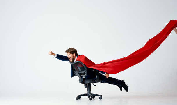 business man in suit office chair red cloak superhero