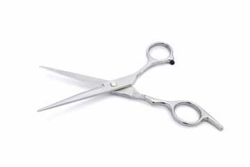 Obraz premium A silver hair cutting scissors with isolated on white background.