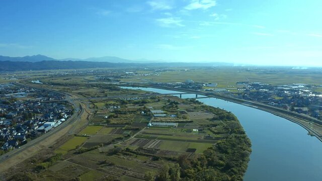 空撮　日本の田舎の風景　きれいな山と川　青い空と緑の田畑