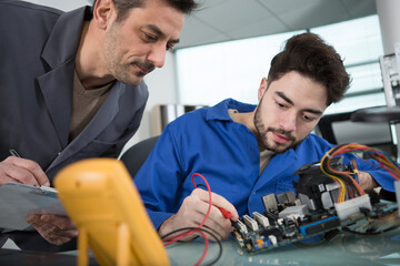 electricians are measuring the current