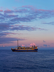 The Alvheim FPSO situated in the Norwegian North Sea attached to its Turret and undergoing maintenance Operations at Dawn. © Julian