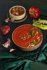 A bowl of Spanish traditional cold tomato and cucumber gazpacho soup