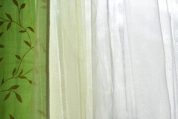 colored curtains on the window of the apartment