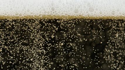 Close-up of champagne bubbles background with foam.