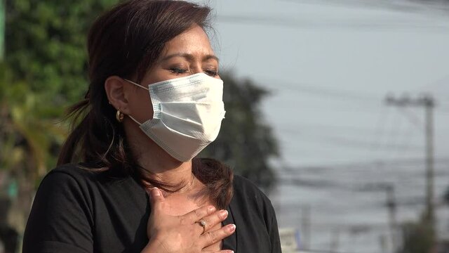 Woman Having Trouble Breathing With Facemask