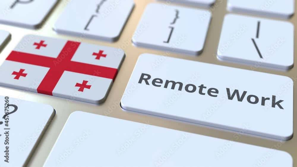 Aufkleber remote work text and flag of georgia on the computer keyboard. telecommuting or telework related con