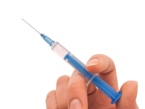Hand and syringe isolated on white background stock photo