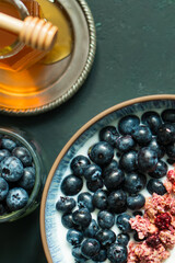 Berry mix bowl super food with healthy granola grain muesli in yogurt for breakfast food meal with honey blueberry strawberry	