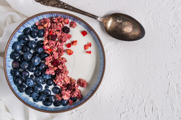 Berry mix bowl super food with healthy granola grain muesli in yogurt for breakfast food meal with honey blueberry strawberry	