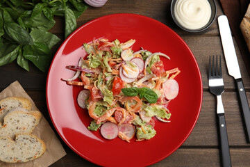 Delicious salad with mayonnaise served on wooden table, flat lay