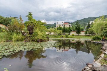 Fototapeta na wymiar The rural scenery after the rain, houses, green mountains and rivers