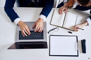 managers laptop and documents on the table technology