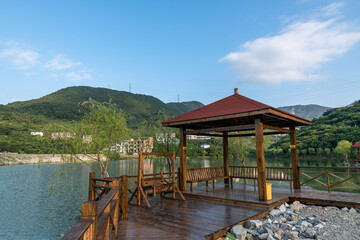 A pavilion by the lake in the country