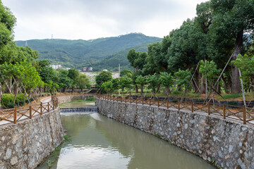 Fototapeta premium Country scenery, stone bridges and waterwheel