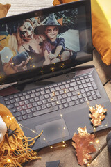 Halloween online virtual holiday remote celebration halloween in lockdown garden quarantine covid new normal, social distance, remote communication,stay home vocation halloween selective focus