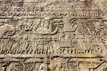 Fototapeta na wymiar detail stone carving on wall of Khmer temple in Angkor Wat, Cambodia 