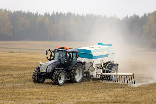 Tractor Spreads Agrilime on Foggy Day