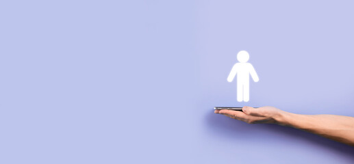 Male hand holding human icon on blue background. Human Resources HR management Recruitment Employment Headhunting Concept.Select team leader concept. Male hand click on man icon.Banner ,copy spase.