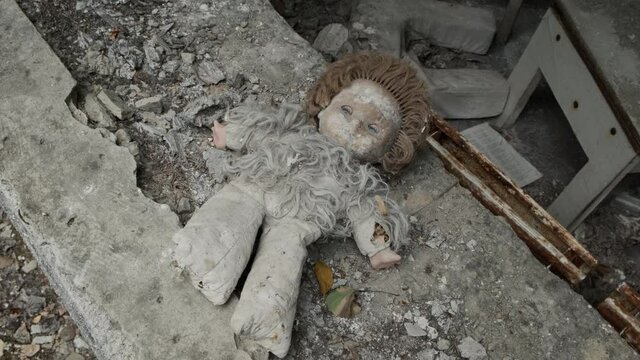 Creepy doll in an abandoned building in ghost town Pripyat. Chernobyl exclusion zone, Ukraine