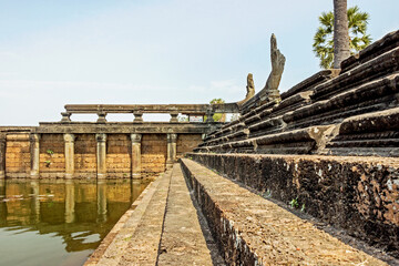 Fototapeta na wymiar ruins of Angkor Wat temple at lakeside in Cambodia 
