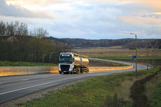 White Volvo FH Tanker Trucking on Road at Sunset