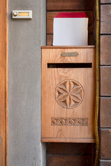 Antique wooden mailbox carved for a house