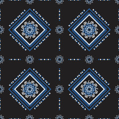 blue ethnic pattern with geometric seamless square in black background for fabric
