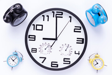 Fototapeta na wymiar Wall clock isolated at white background. Office alarm clock view