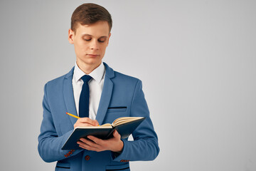 business man in suit writing on notepad work office manager