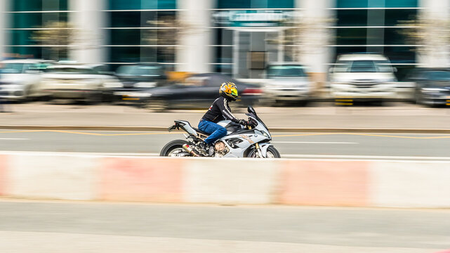 BMW S1000RR is a race oriented sport bike initially made by BMW Motorrad. Fast moving motorcycle, side view