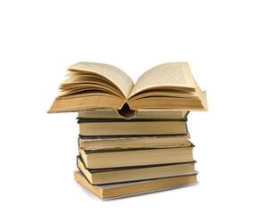 An open paper book lies on a stack of books. Stack of old retro books isolated on white background. Education concept.